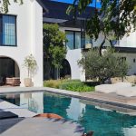 Poolside seating with mature olive trees and soft planting by CSA Landscaping, leading precision landscapers in the Boland and Cape Winelands, Val de vie. CSA Landscaping